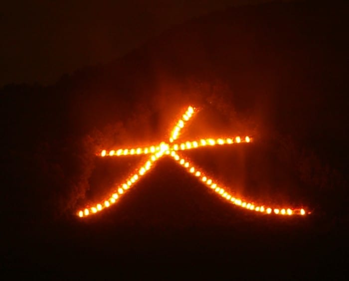 Large bonfires on the hills around Kyoto send ghosts back to the heavens.