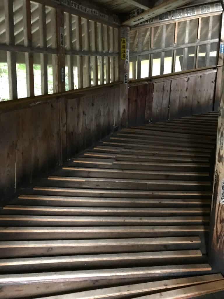 Wooden ramps lead up and down through Sazaedo's double helix structure.