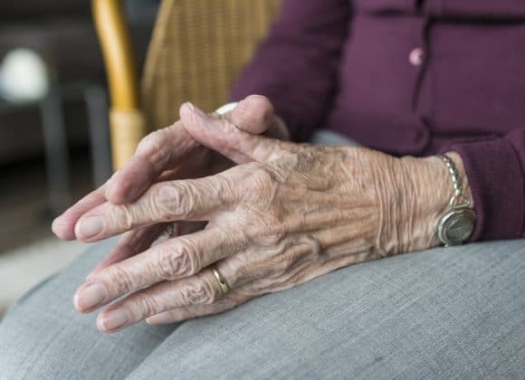 elderly hands of woman who surprised me by telling me when she was the happiest
