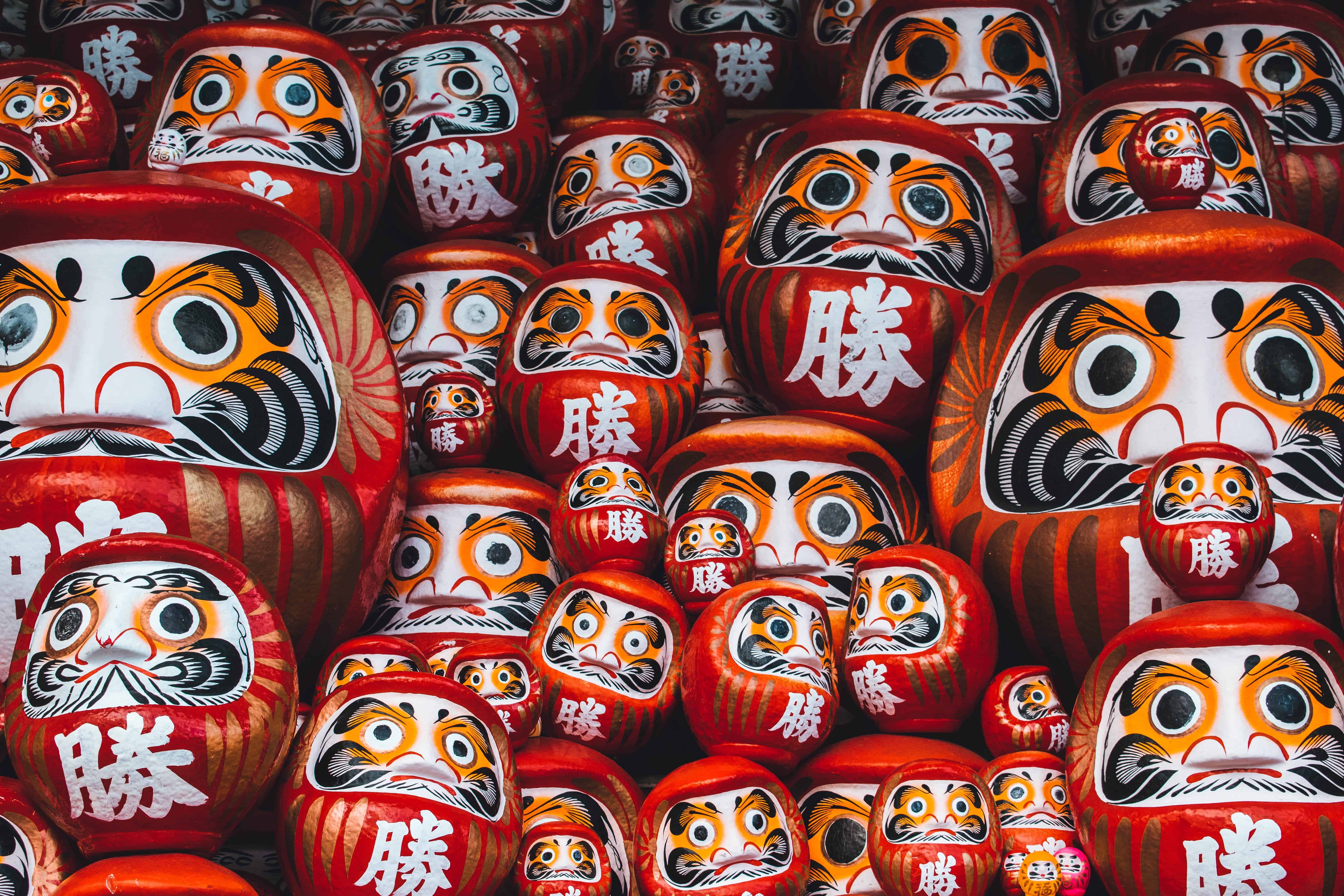 Daruma dolls waiting to be burned at a Shinto Shrine.