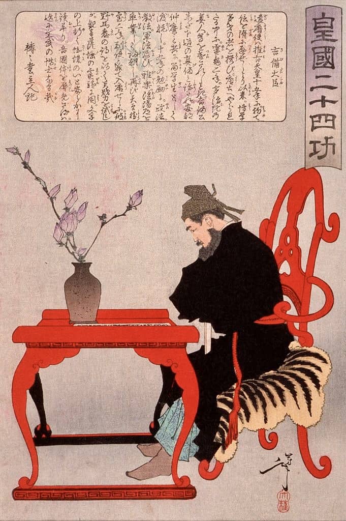 Kibi no Makibi seated at a Chinese writing desk.