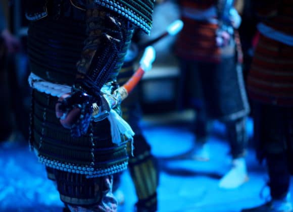 Samurai sword and armor in dark blue light.