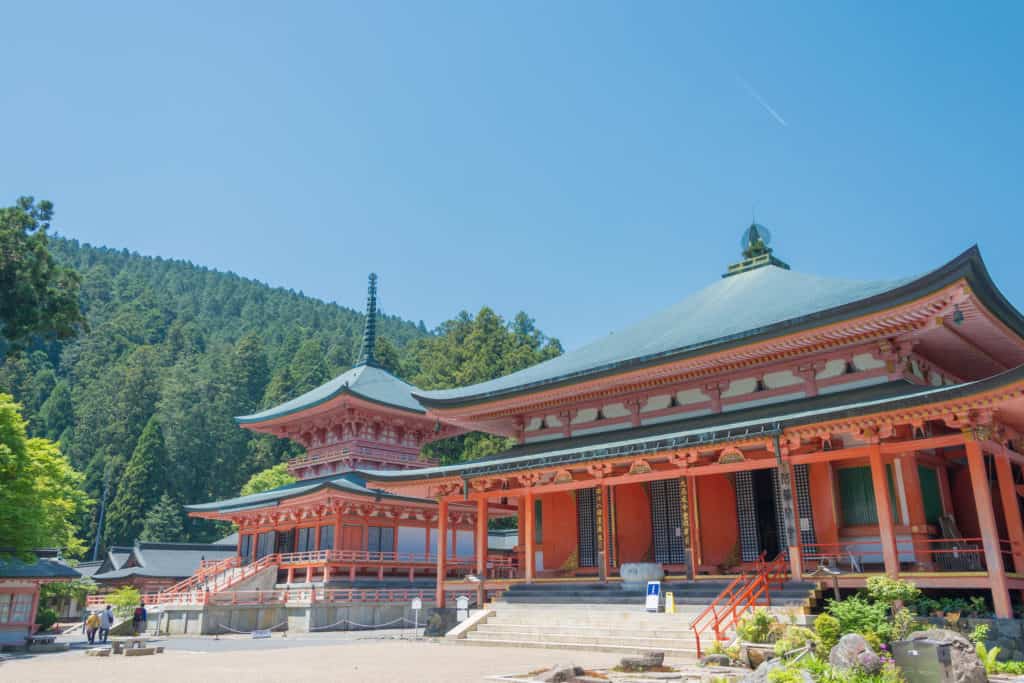 Brilliant vermillion temple with blue roof tiles atop Mount Hiei, northwest of Kyoto.